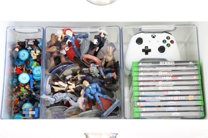 Organized LEGO, Disney Infinity Characters, and Video Games in Plastic Bins