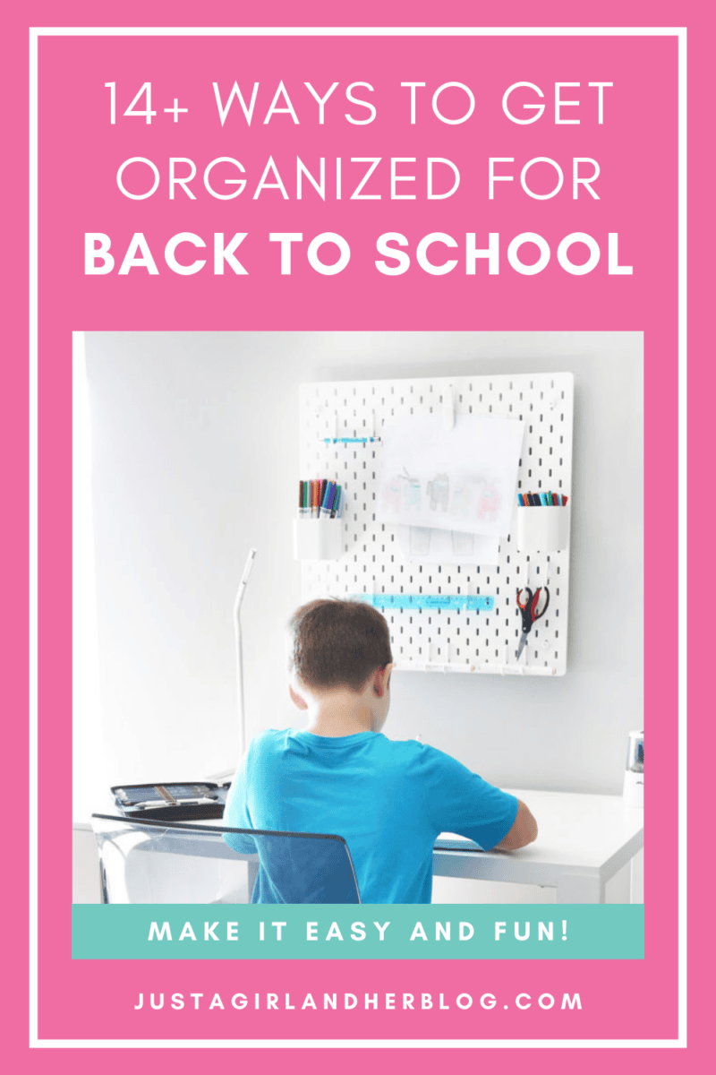 Boy in a blue shirt sitting at a white desk doing homework with an organized peg board for back to school