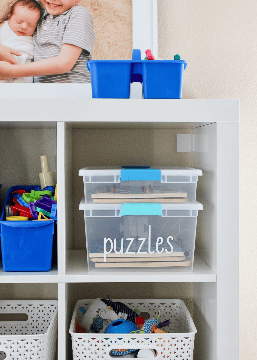 Wood Puzzles Organized in Clear Bins from The Homes I Have Made