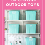 Teal storage bins on a garage shelving rack used for storing outdoor toys